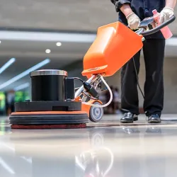 Cleaning and Janitorial Services: photo shows a floor buffer in use by a janitor